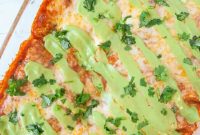 Baked Red Chicken Enchiladas with Creamy Avocado Sauce