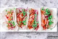 Spicy-Sweet Salmon Tacos with Apple Almond Slaw