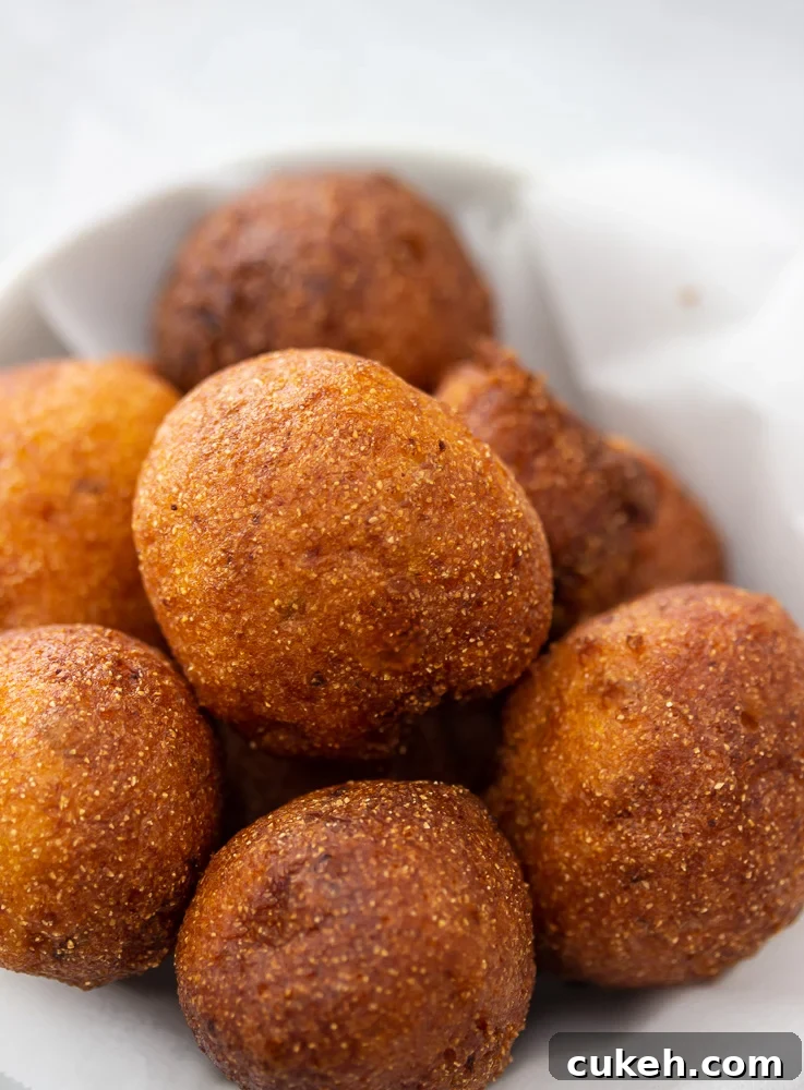 a bowl of golden brown hush puppies