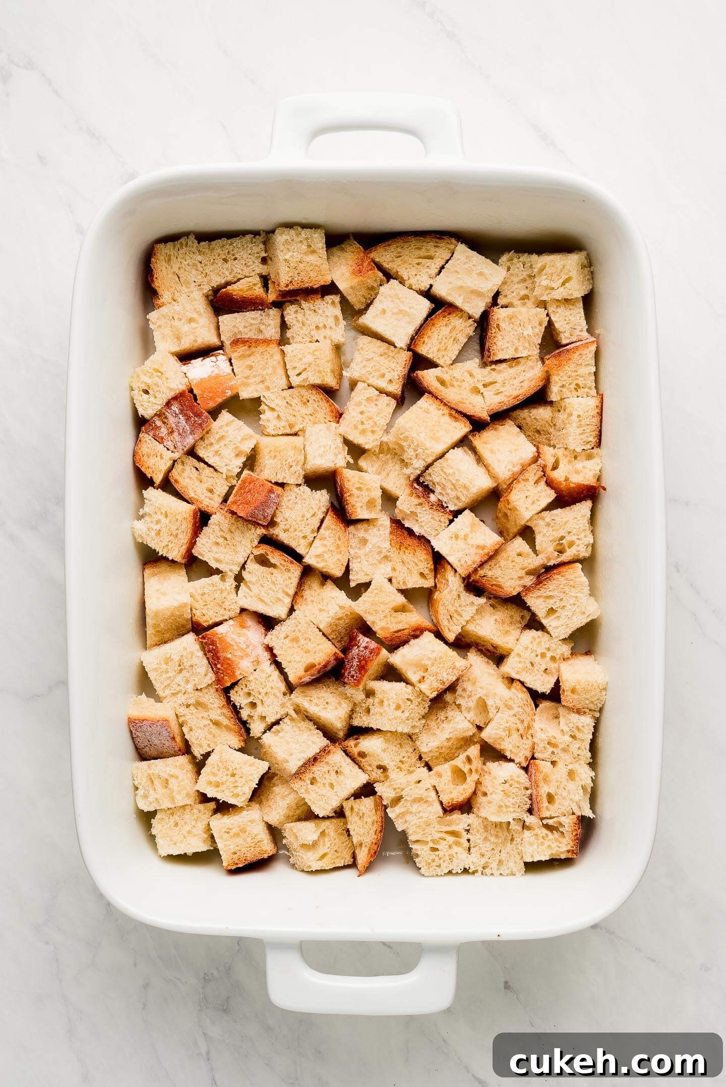 Bread cubes in a baking dish.
