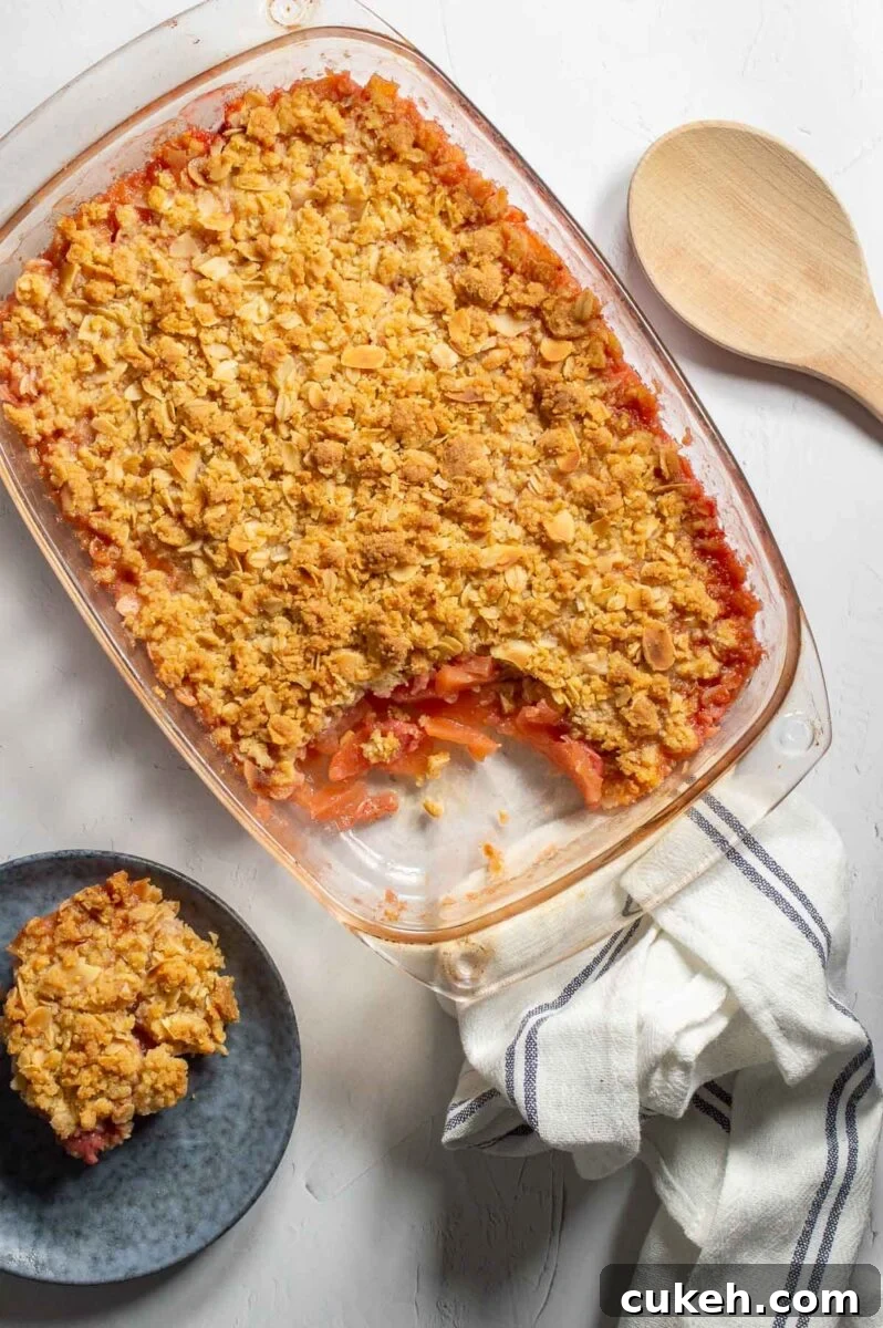 Strawberry Apple Crisp with Cinnamon Oat Topping 2 Top-down view of a fruit crisp in a glass dish.