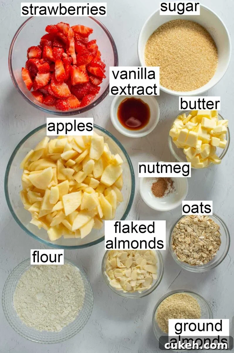 Strawberry Apple Crisp with Cinnamon Oat Topping 3 Labelled ingredients including strawberries, sugar, vanilla extract, apples, butter, nutmeg, flaked almonds, oats, flour and ground almonds.