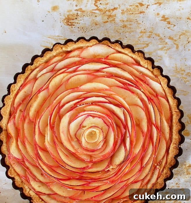 A whole tart with apple slice rose treatment.