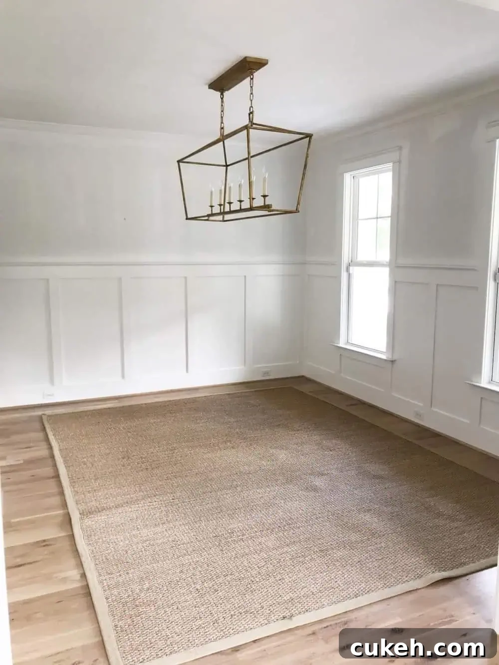 empty dining room with white walls and visual comfort darlana hanging