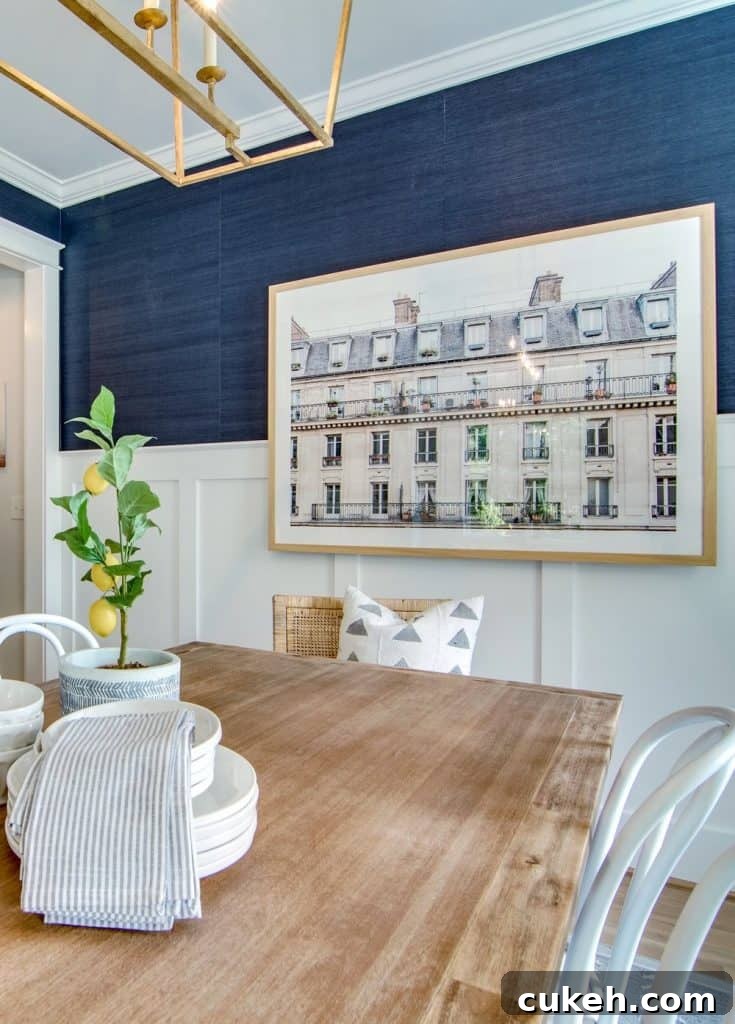 big piece of artwork in a blue dining room