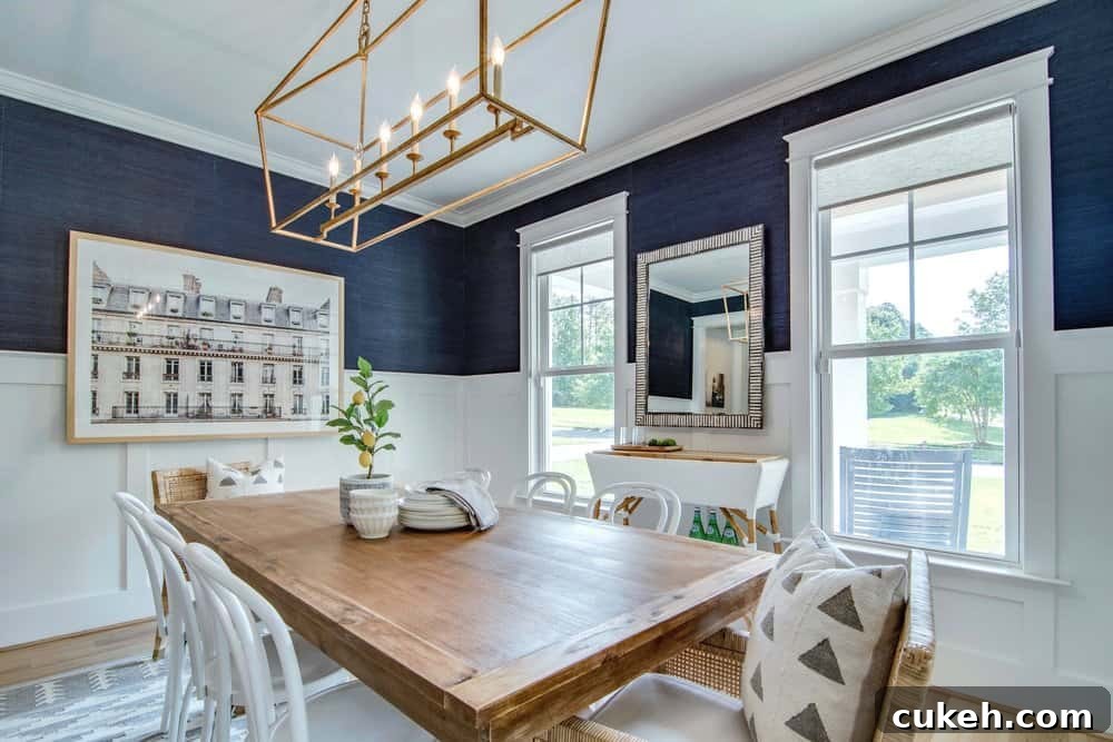 View of the two windows with navy wallpaper in a blue dining room