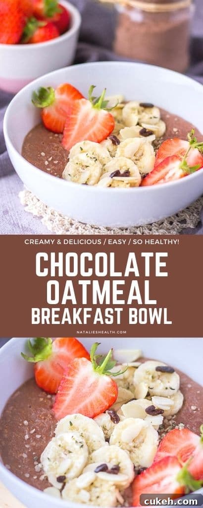 Chocolate oatmeal breakfast bowl served with fresh strawberries and banana
