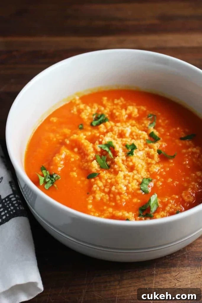 This red pepper carrot soup gets a ton of flavor from harissa, and is extra satisfying on a chilly fall evening with the amazing addition of a couscous swirl.