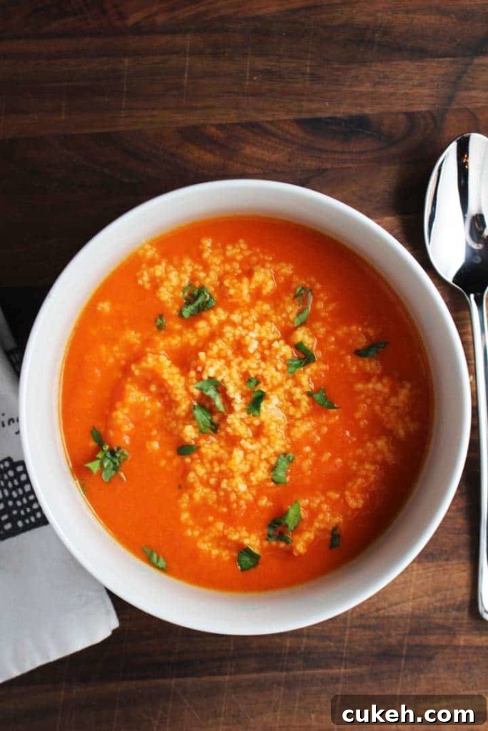 This red pepper carrot soup gets a ton of flavor from harissa, and is extra satisfying on a chilly fall evening with the amazing addition of a couscous swirl.