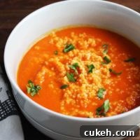 This beautiful, bold soup gets a ton of flavor from harissa, and is extra satisfying on a chilly fall evening with the amazing addition of a couscous swirl.