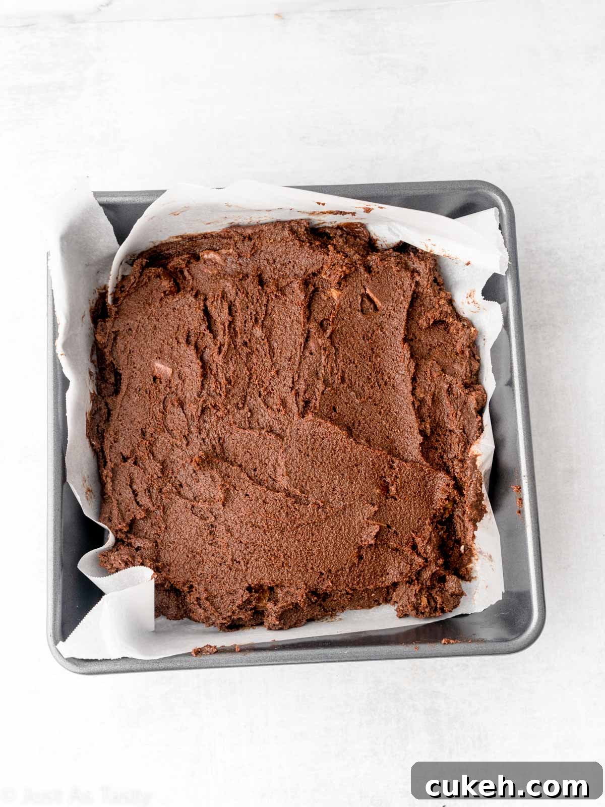 Brownie batter in a pan.