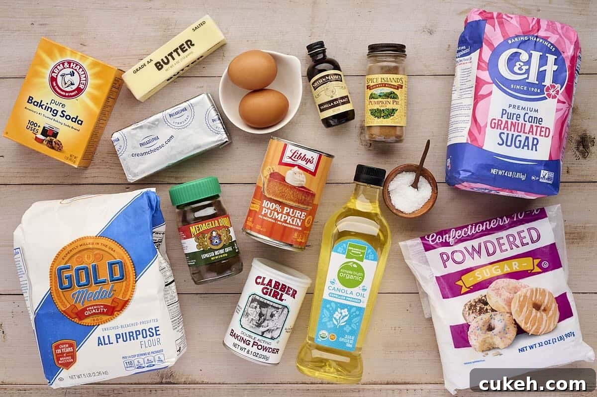 Ingredients to make pumpkin cookies with cream cheese frosting laid on a table.