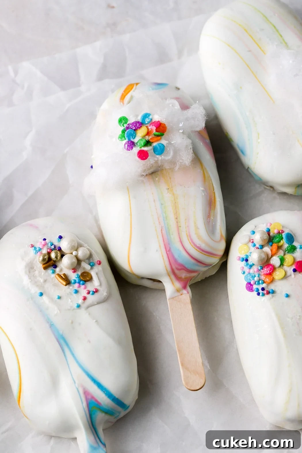 rainbow cakesicles with sprinkles