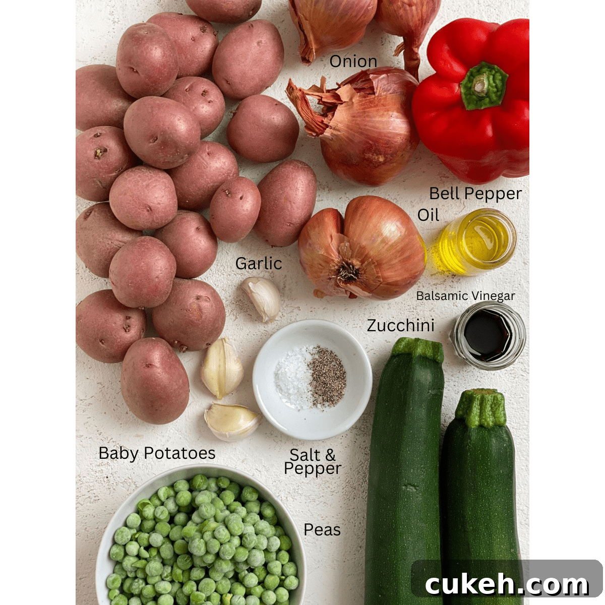 Sautéed Baby Potatoes and Mixed Vegetables Skillet 3 ingredients for Garlic Baby Potato Bowl measured out against a white surface