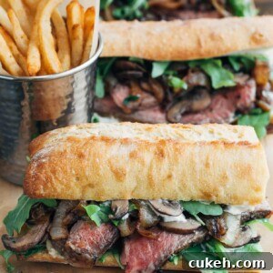 steak sandwiches with horseradish mayo on a wood board