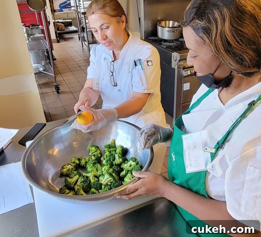 Mastering Vegetable Steaming: Techniques for Better Flavor & Texture 9 School nutrition professional preparing broccoli with citrus zest.