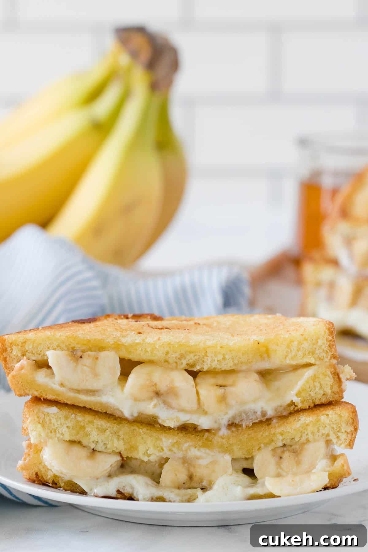 A honey banana grilled cheese sandwich on a plate.