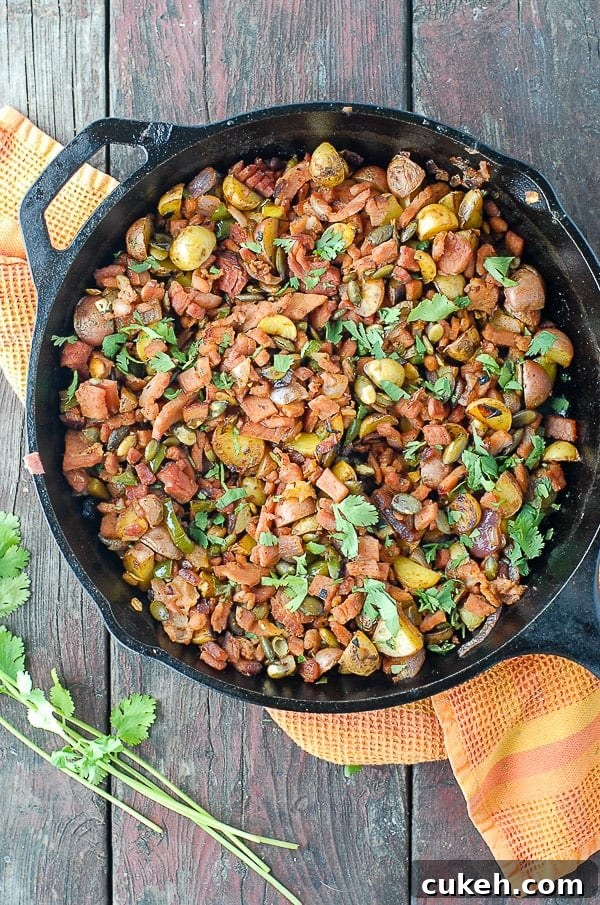 64 Tasty Leftover Ham Recipes for Every Meal 11 Top-down view of a cast iron skillet holding diced ham and potatoes