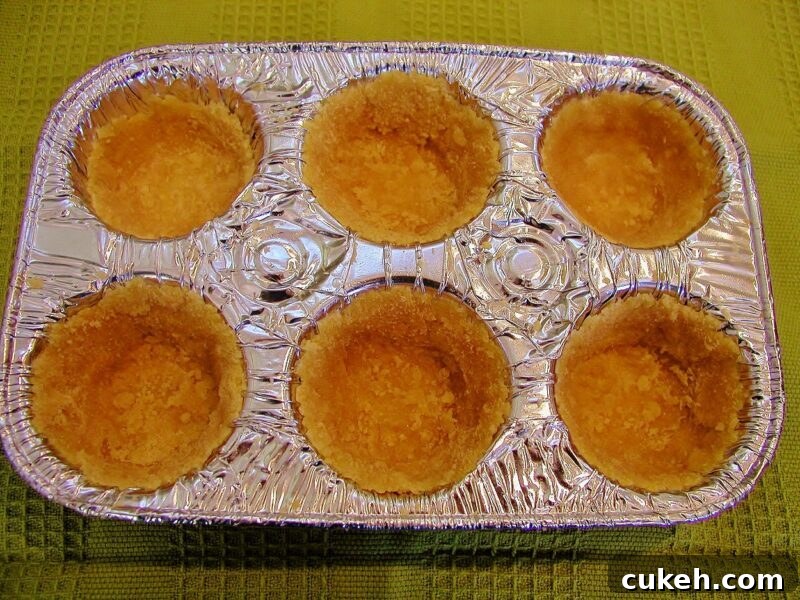 Crust pressed into muffin pan