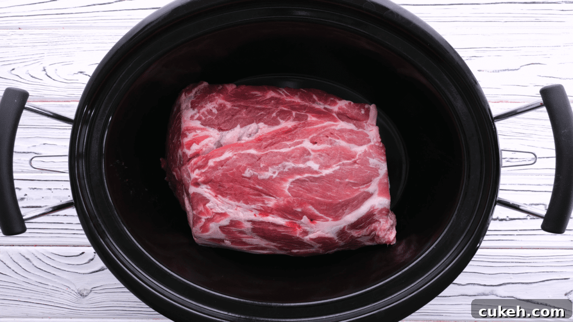 For pulled pork sliders, place pork roast in slow cooker.