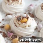 Easter meringue nests on a white platter.