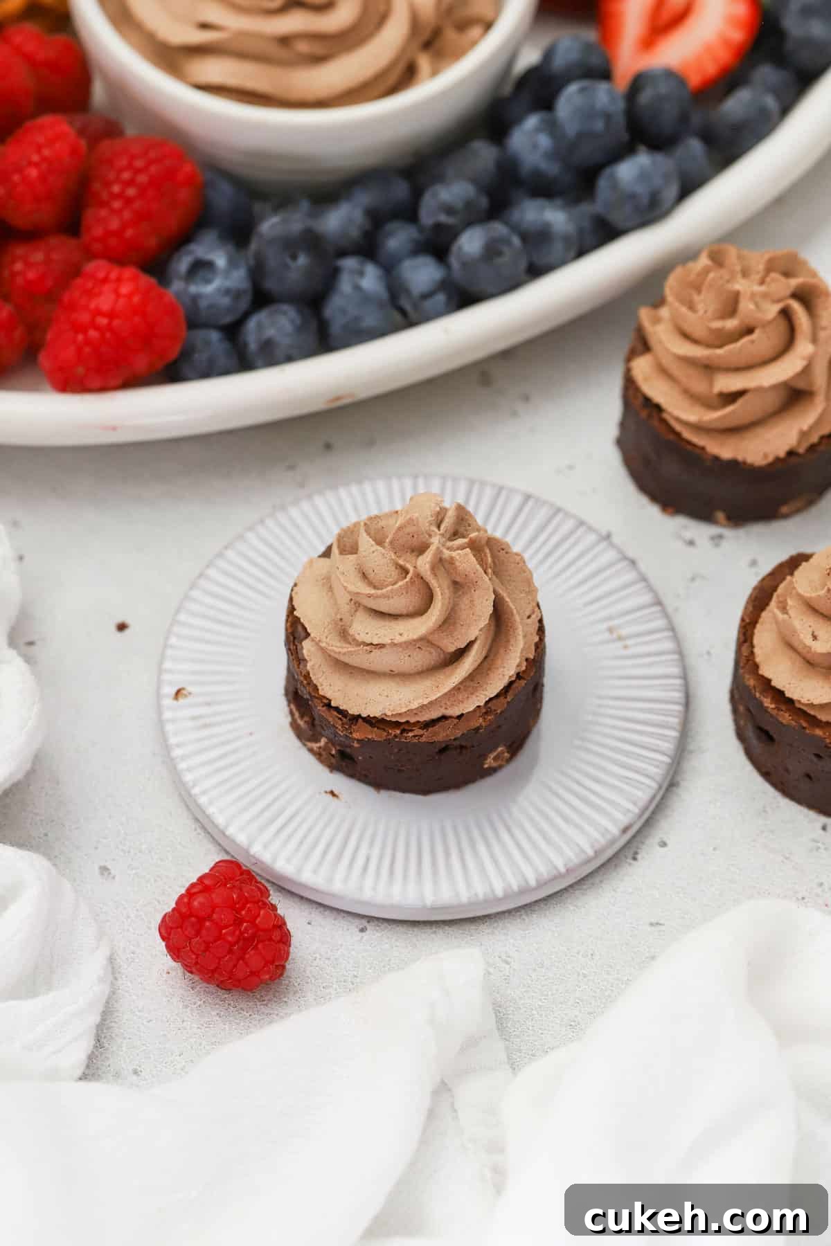 Brownie bites topped with chocolate whipped cream