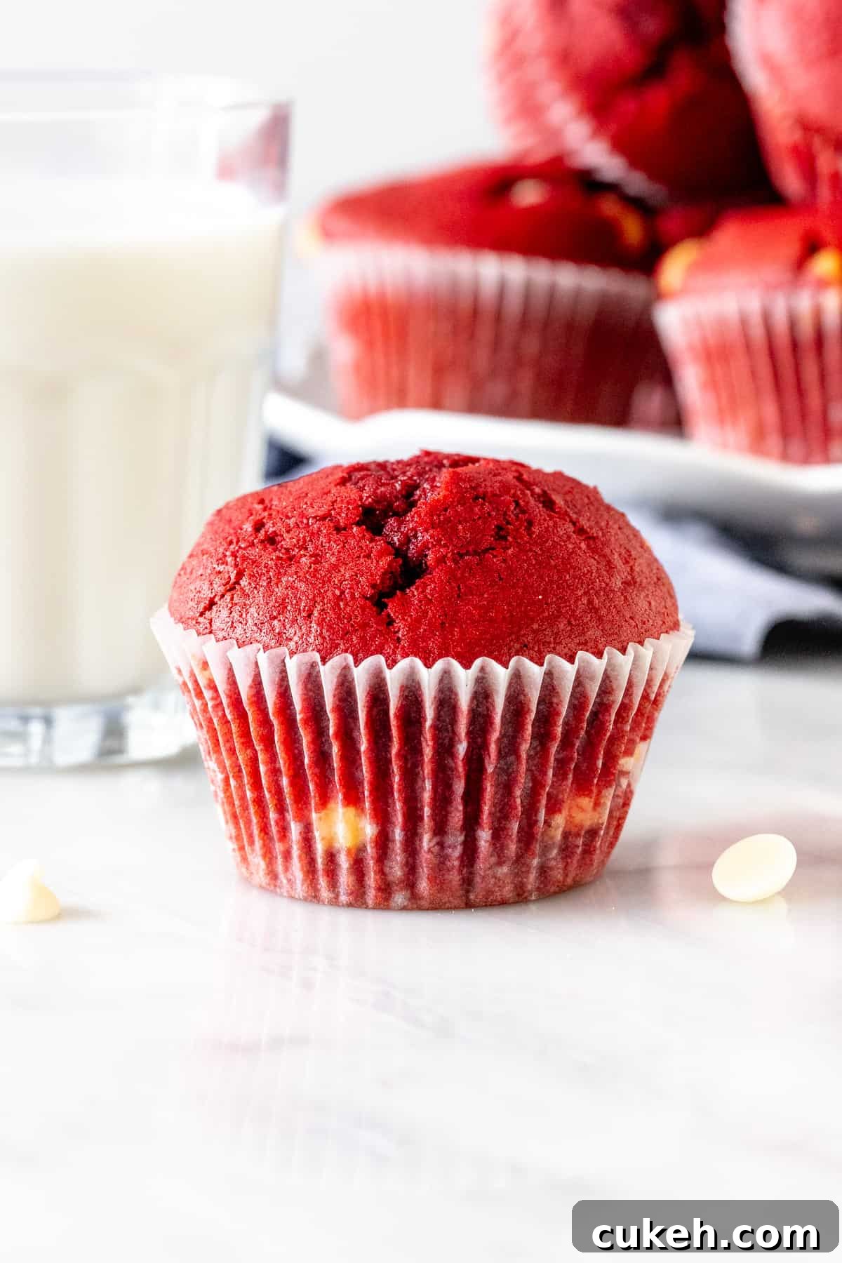 Red velvet chocolate chip muffin with glass of milk