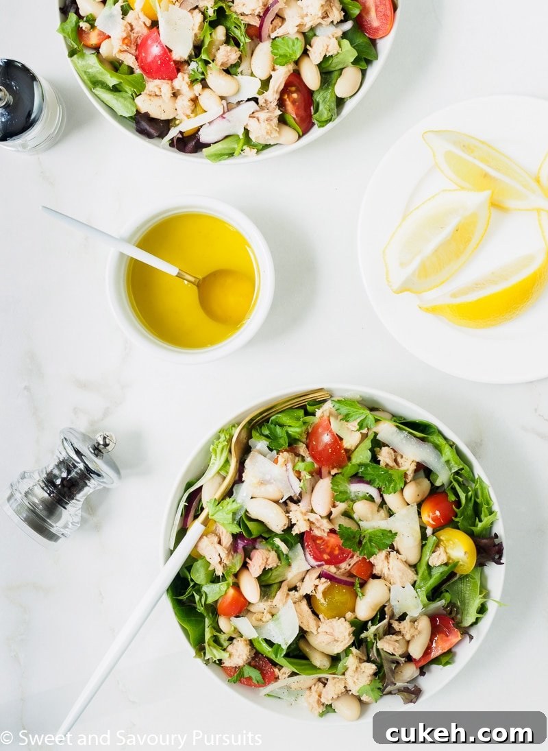 Bowls of Bean and Tuna Salad served with a lemon and olive oil dressing on the side.