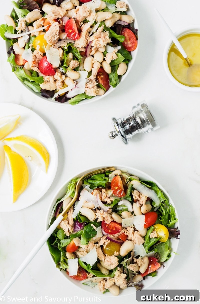 White Bean and Tuna Salad bowls served with a lemon and olive oil vinaigrette on the side.