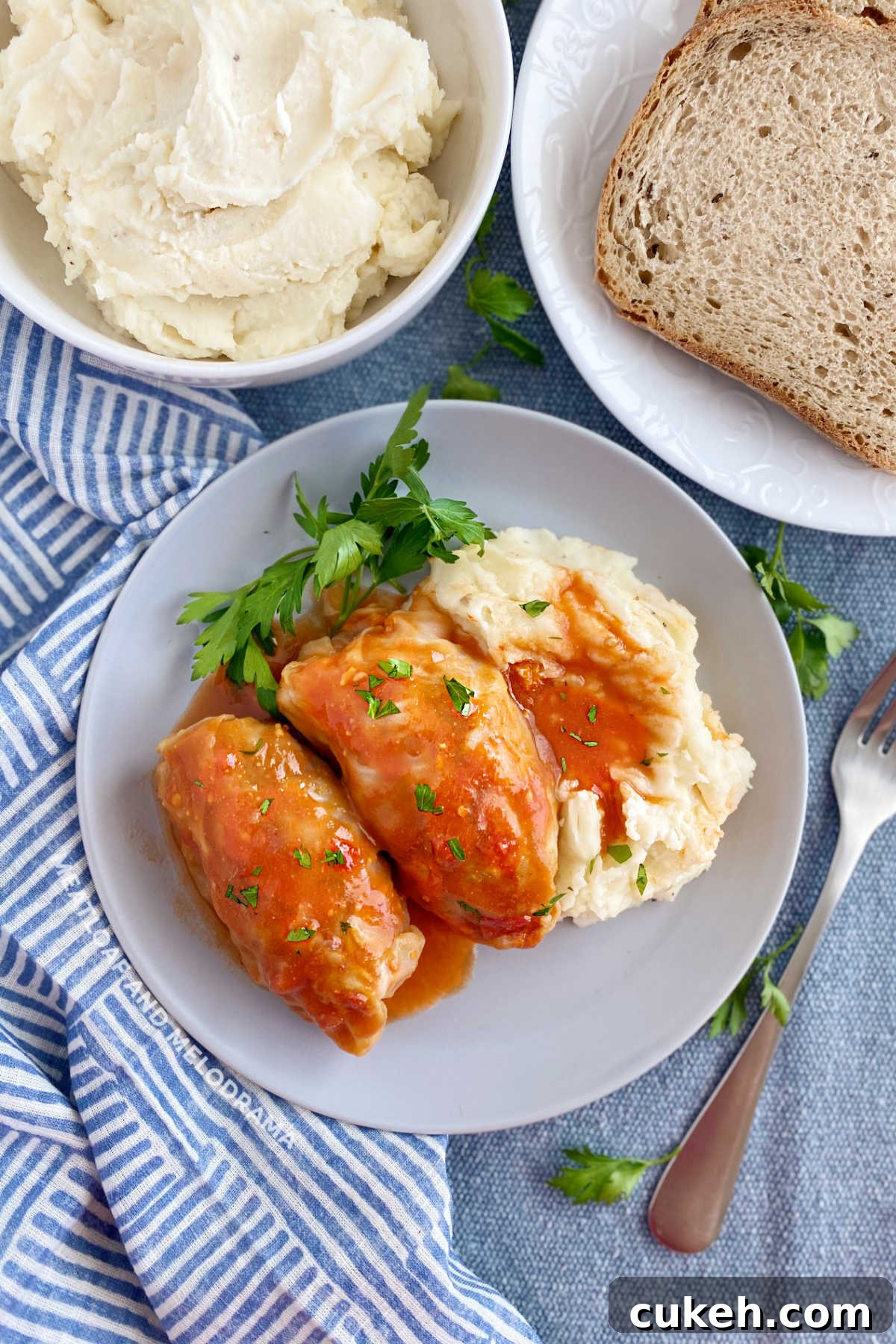 Grandma's cabbage rolls in tomato soup sauce with mashed potatoes and rye bread on the table