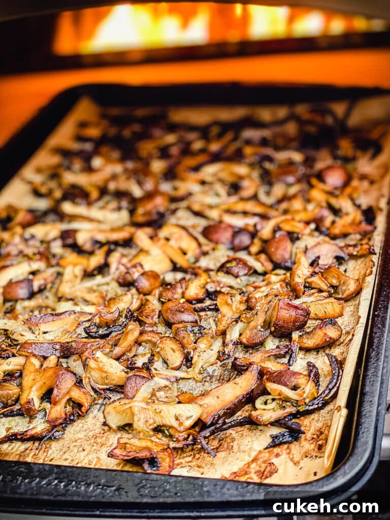 roasted mushrooms coming out of a pizza oven