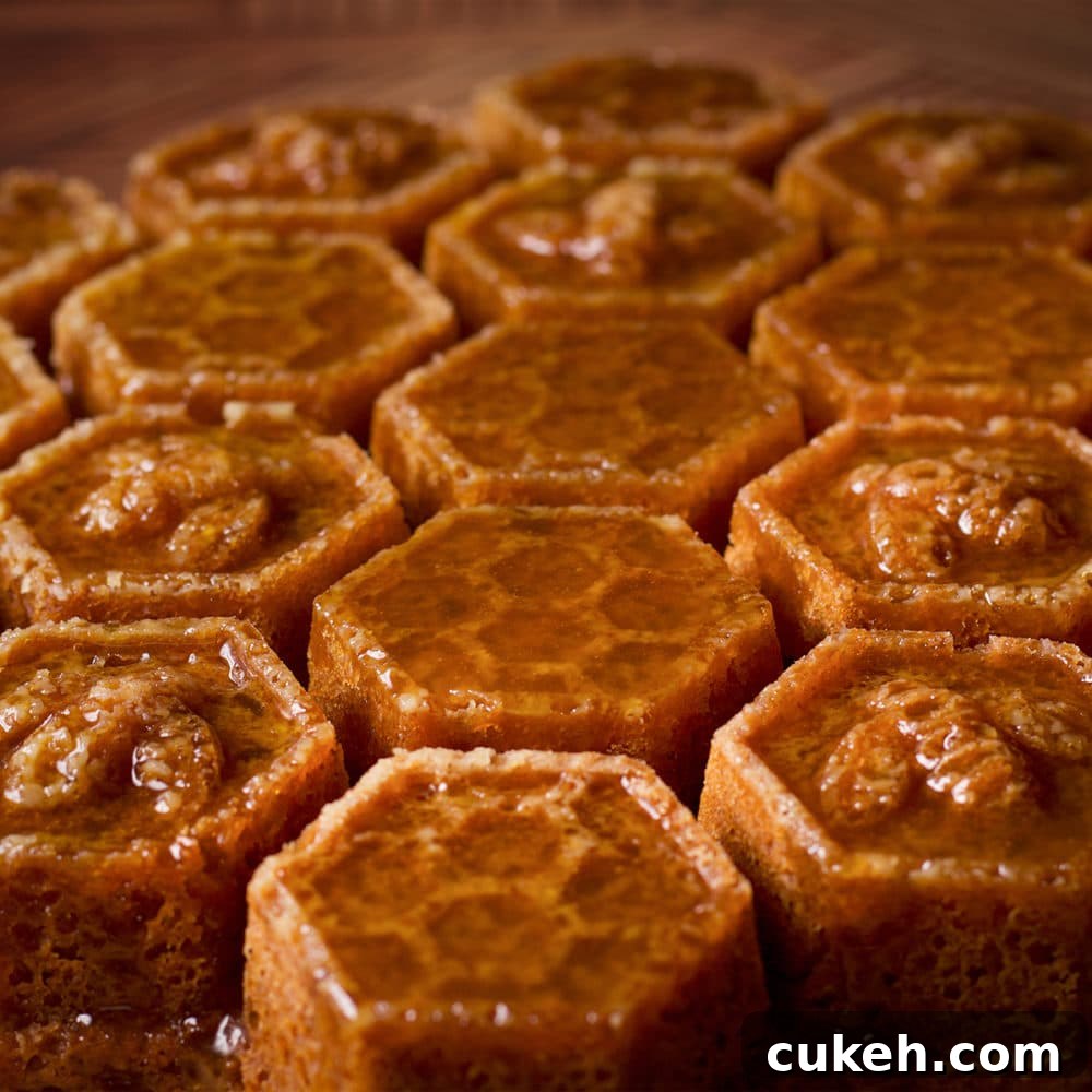 A honey cake, baked in a honeycomb pan, that's been covered in whisky sauce.