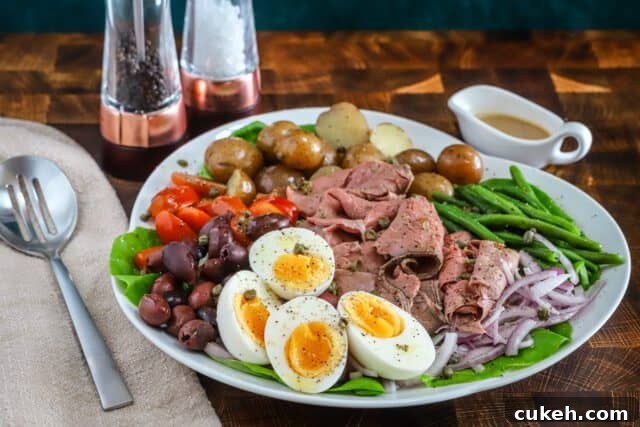 A flavorful composed Nicoise salad made with deli sliced roast beef and traditional Nicoise ingredients, finished with a Dijon dressing.