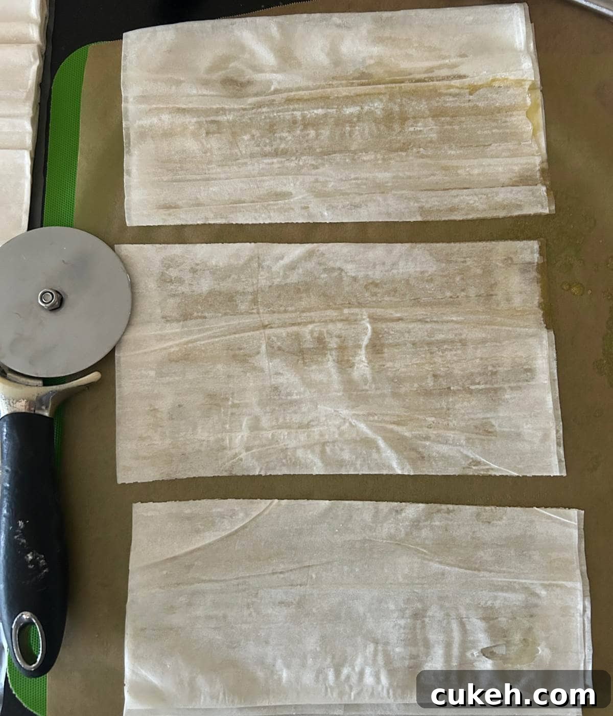 Phyllo dough sliced into 3 rectangles.