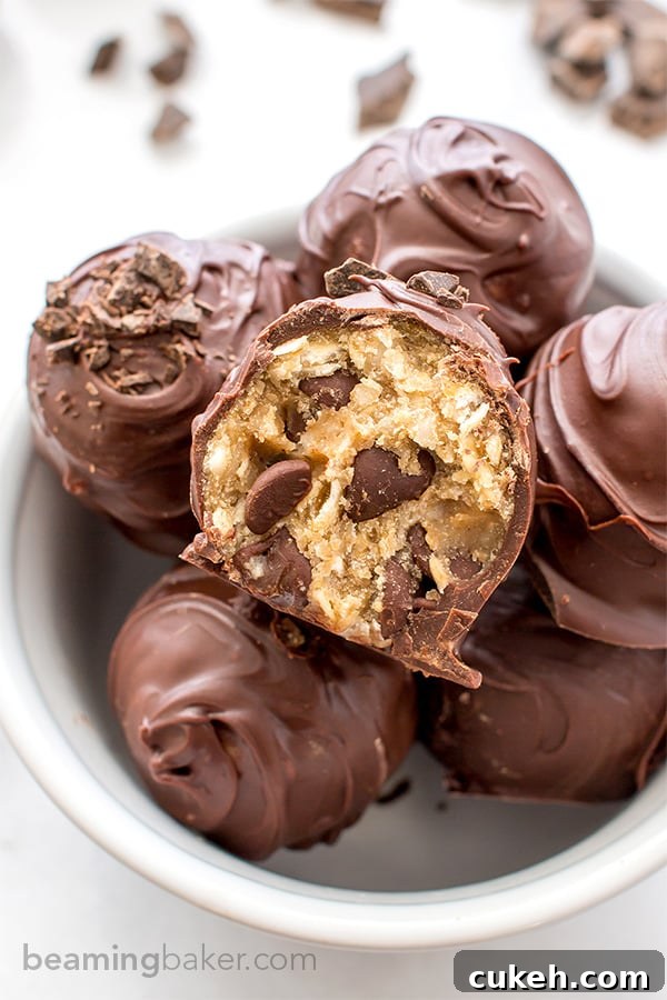 Chocolate Chip Cookie Dough Truffles (V+GF): Decadent cookie dough centers studded with chocolate chips and encased in a smooth, dark chocolate shell. BEAMINGBAKER.COM. #Vegan #GlutenFree