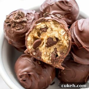 Chocolate Chip Cookie Dough Truffles (V+GF): Decadent cookie dough centers studded with chocolate chips and encased in a smooth, dark chocolate shell. BEAMINGBAKER.COM. #Vegan #GlutenFree
