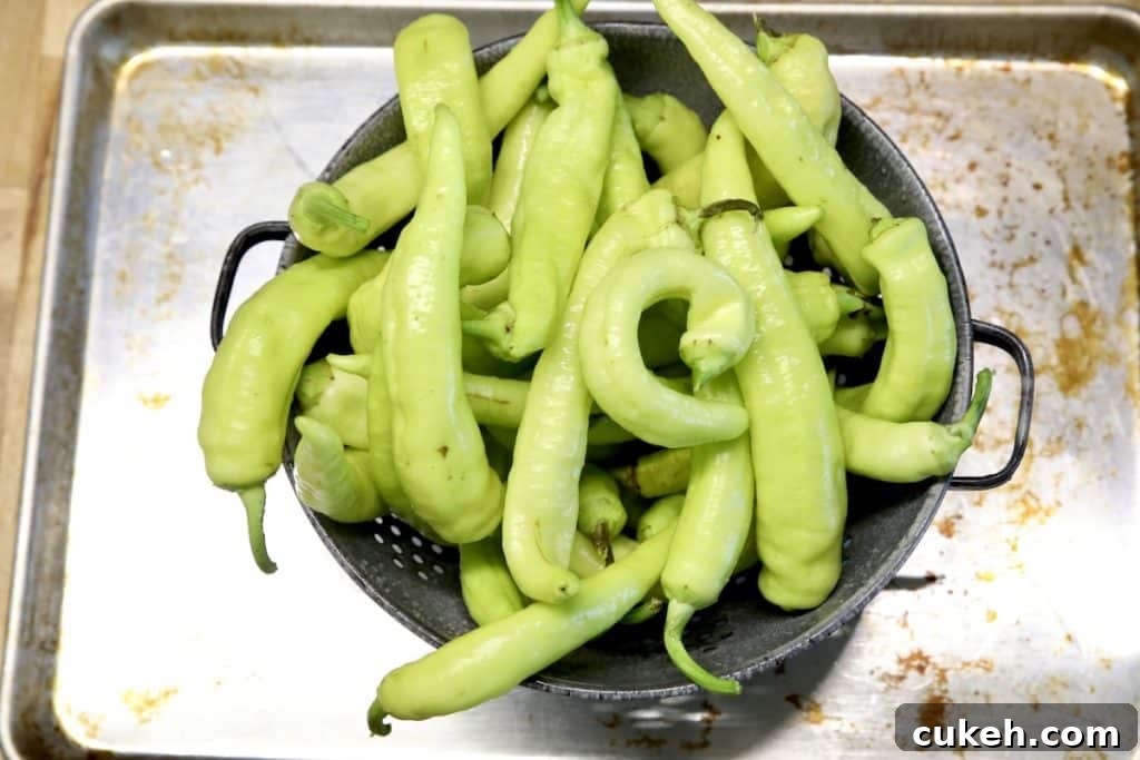 Colander full of banana peppers.