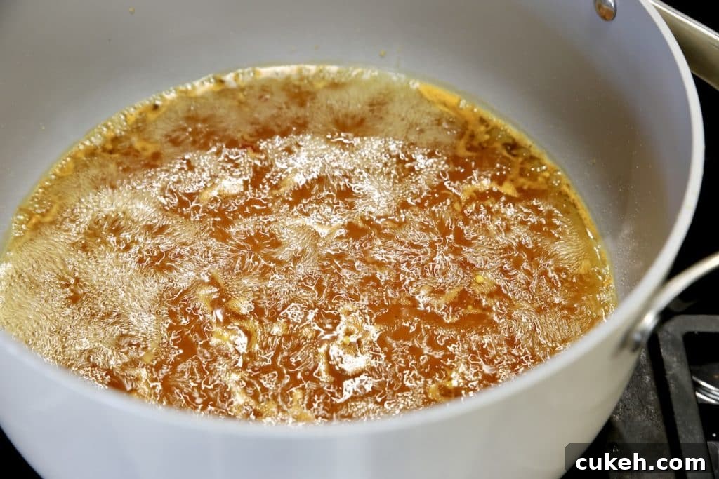 Brine for candied banana peppers in a pan - boiling.