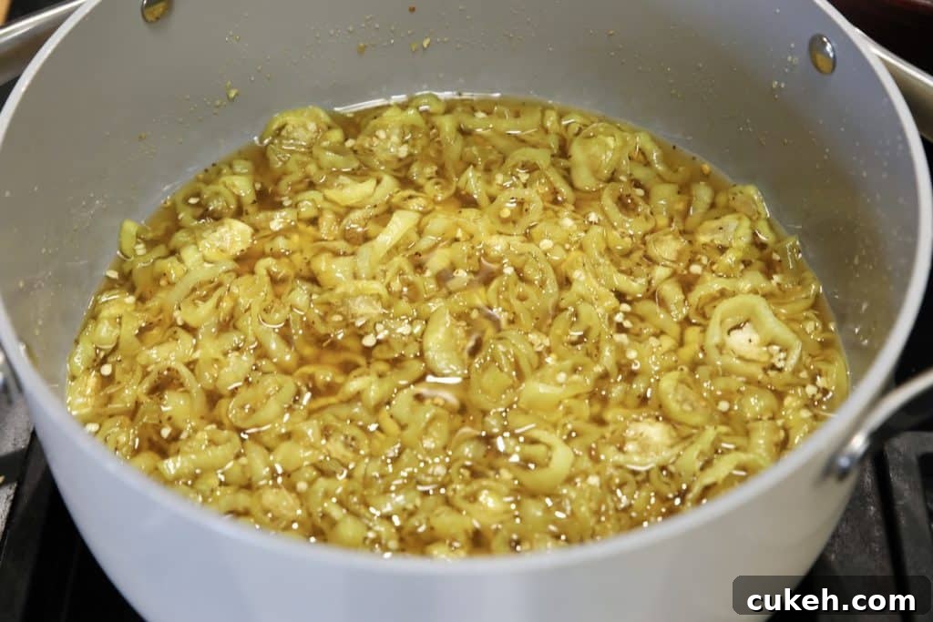 Banana pepper rings cooked in sweet brine.