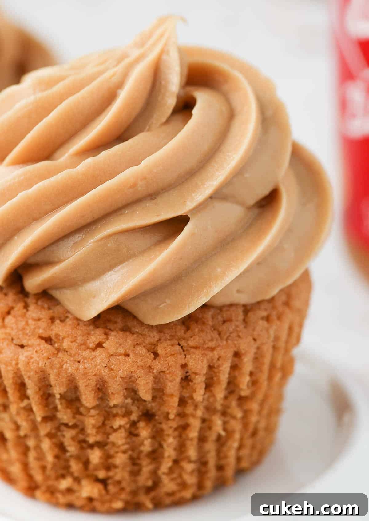 Close up on the frosting piped over a cupcake.