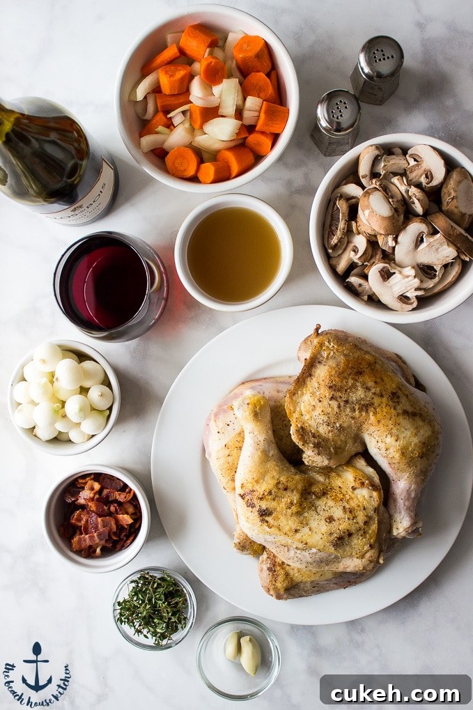 Chicken on a white plate, carrots and onions, bacon, mushrooms, thyme leaves, garlic cloves, pearl onions and chicken broth in white bowls. Salt and pepper shakers, wine glass and red wine.