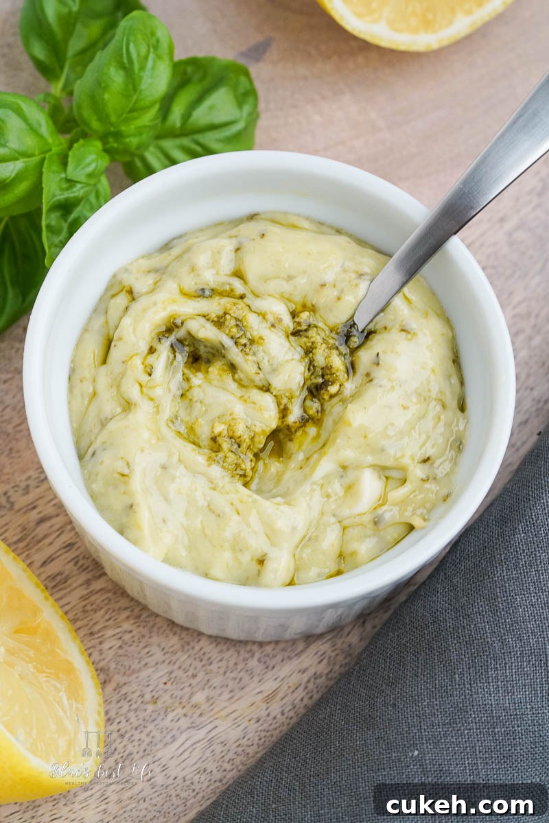 A bowl with pesto aioli and fresh basil
