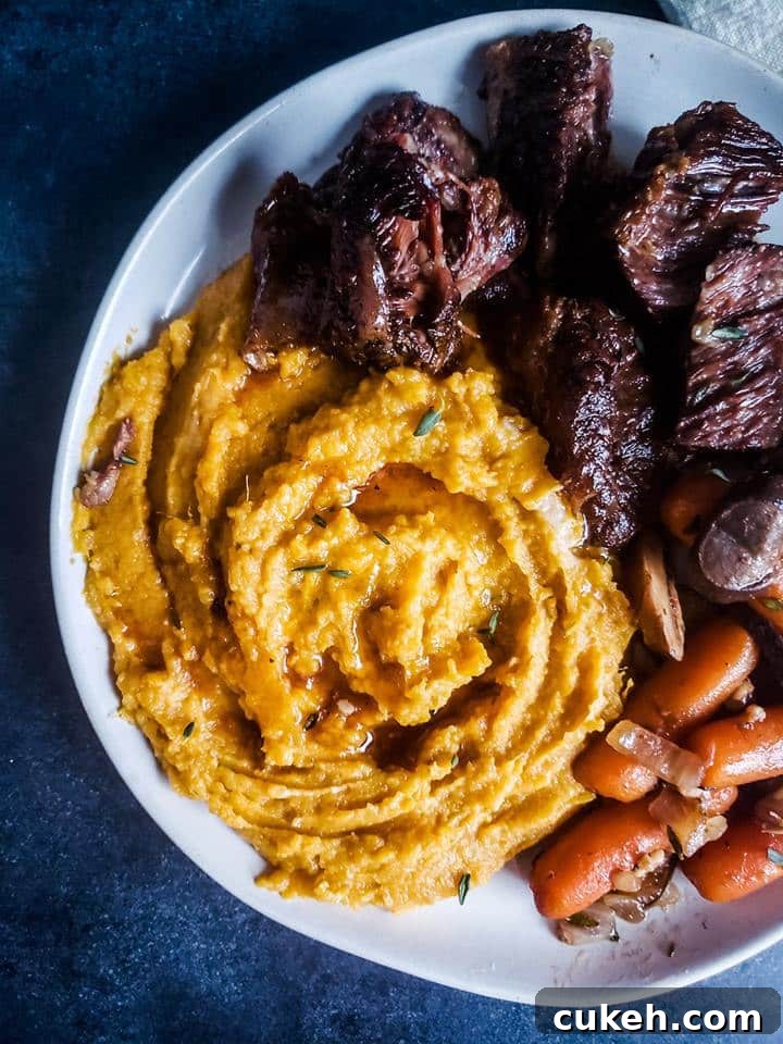 Overhead shot of finished plate with potatoes and ribs.