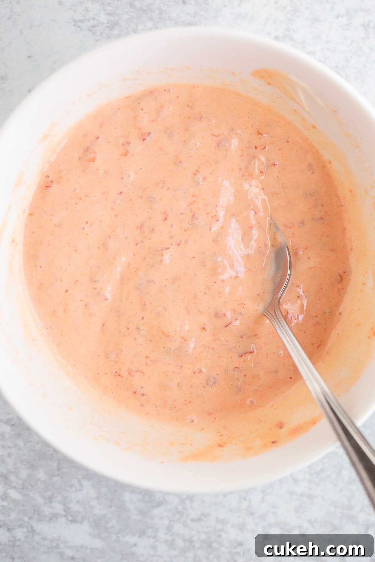 Harissa mayo in a white bowl