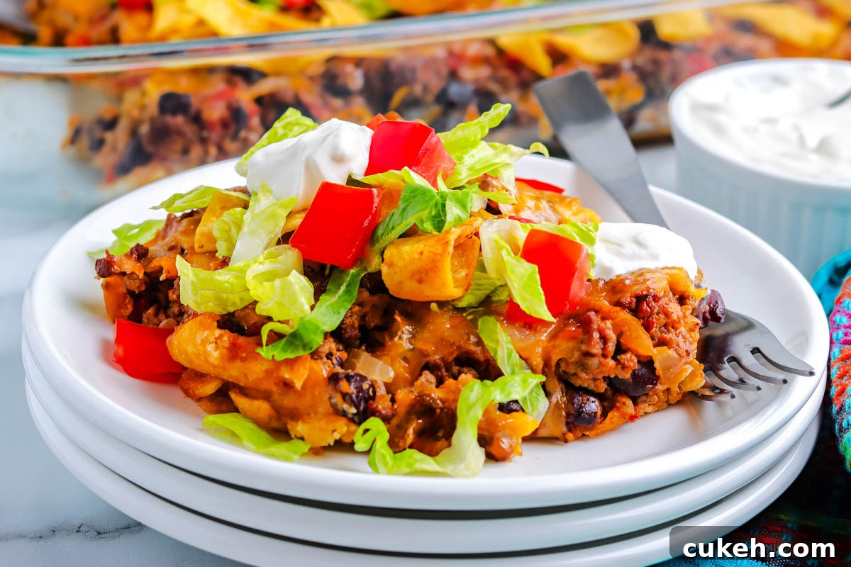 The finished walking taco casserole scooped on a white plate.