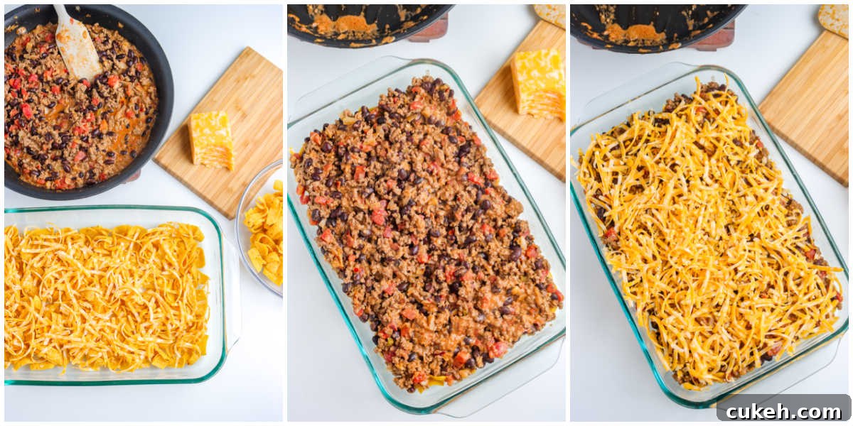 The casserole layered with Fritos, the beef mixture, and cheese.