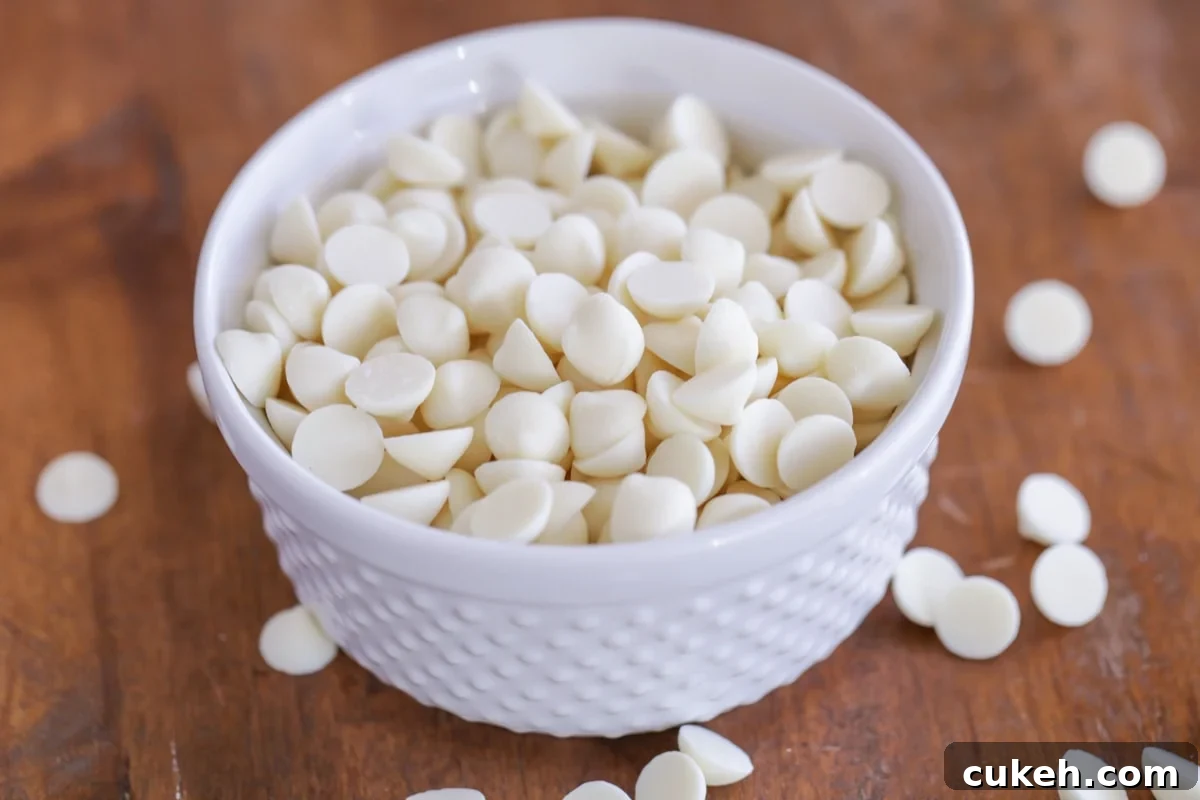 A bowl of white chocolate chips to use in white chocolate snickerdoodle recipe