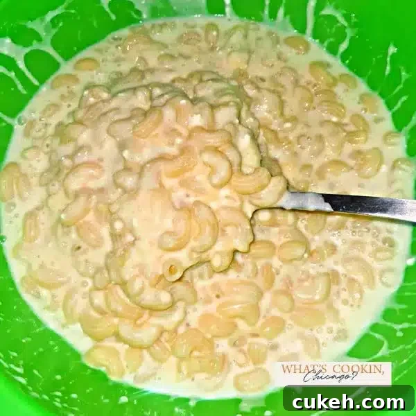 mixing cream and mac in green bowl