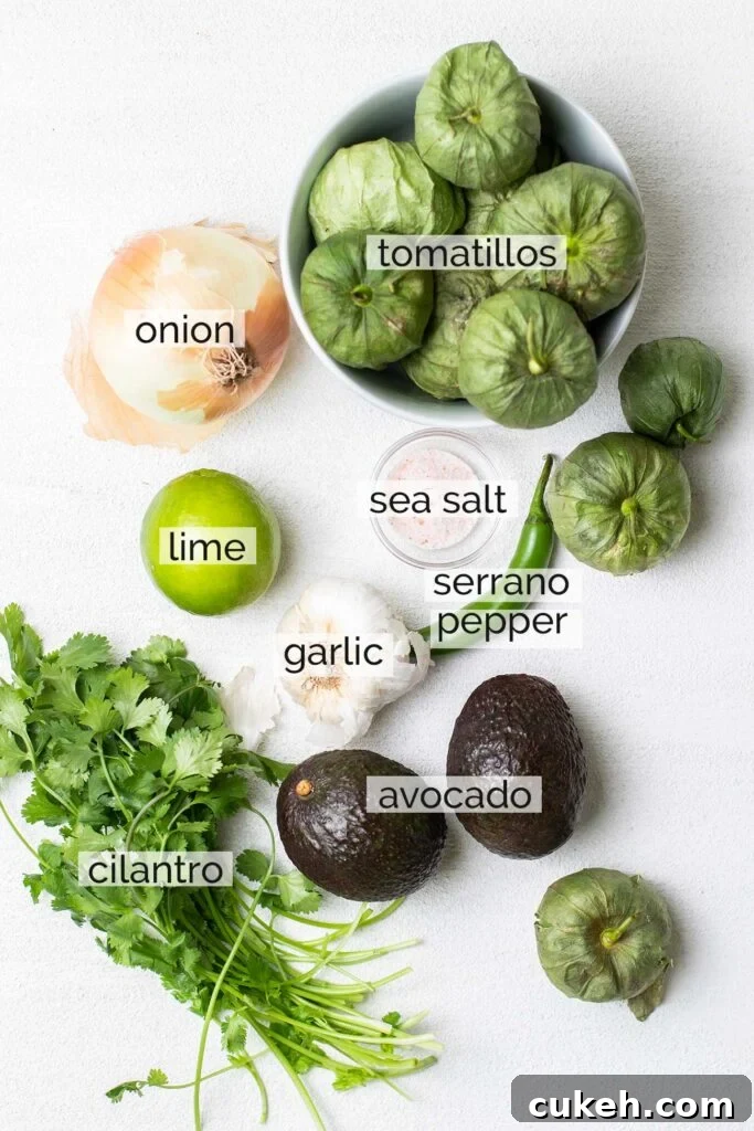 The ingredients needed to make a creamy tomatillo avocado salsa.