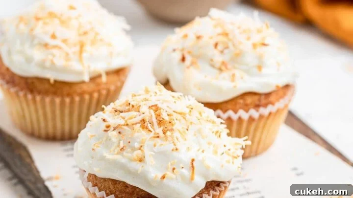 Small batch of coconut cupcakes on table.